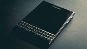 BlackBerry Passport 2025 smartphone with 4.5-inch square display and physical keyboard.